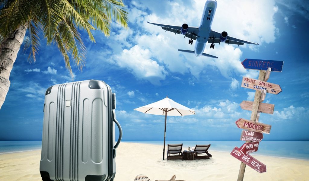 Beach suitcase travel tourism concept
